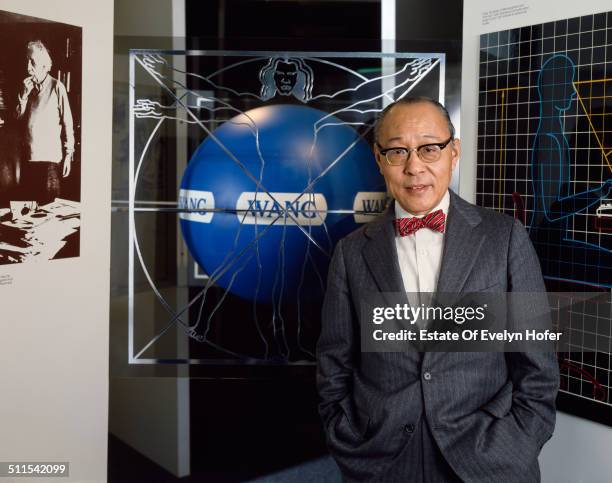 Chinese American inventor and computer engineer Dr. An Wang, co-founder of Wang Laboratories, with a photo of Albert Einstein, New York, 1982.