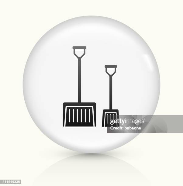 shovels icon on white round vector button - shoveling snow stock illustrations