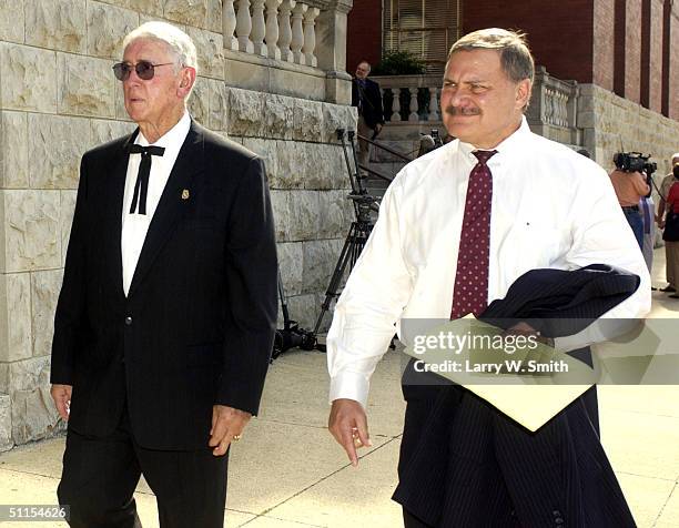 Lou Keel , a member of the prosecution team, leaves the Pittsburg County courthouse along with former District Attorney Bob Macy August 9, 2004 in...