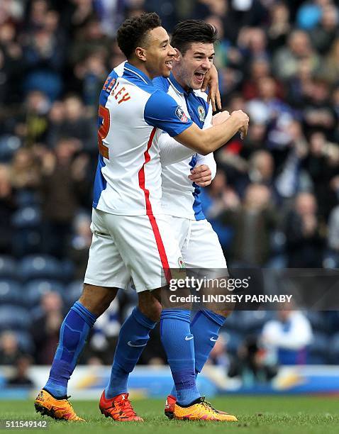 Blackburn Rovers' English midfielder Ben Marshall celebrates with Blackburn Rovers' Welsh defender Adam Henley after scoring the opening goal of the...