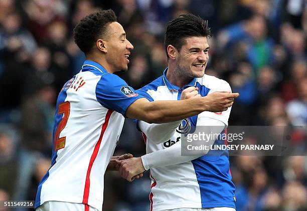 Blackburn Rovers' English midfielder Ben Marshall celebrates with Blackburn Rovers' Welsh defender Adam Henley after scoring the opening goal of the...