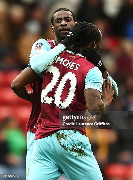 Victor Moses of West Ham United is congratulated by teammate Pedro Mba Obiang after scoring a goal to level the scores at 1-1 during The Emirates FA...