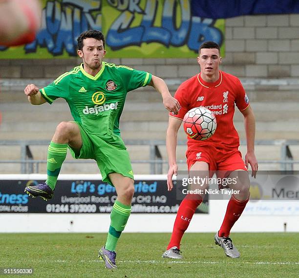 Lloyd Jones of Liverpool and George Honeyman of Sunderland in action during the Liverpool v Sunderland Barclays U21 Premier League game at the...