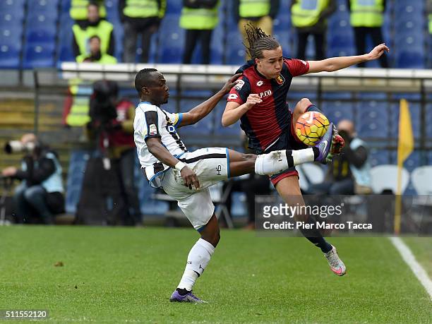 Emmanuel Badu of Udinese calcio competes for the ball with Diego Laxalt of Genoa CFC during the Serie A match between Genoa CFC and Udinese Calcio at...
