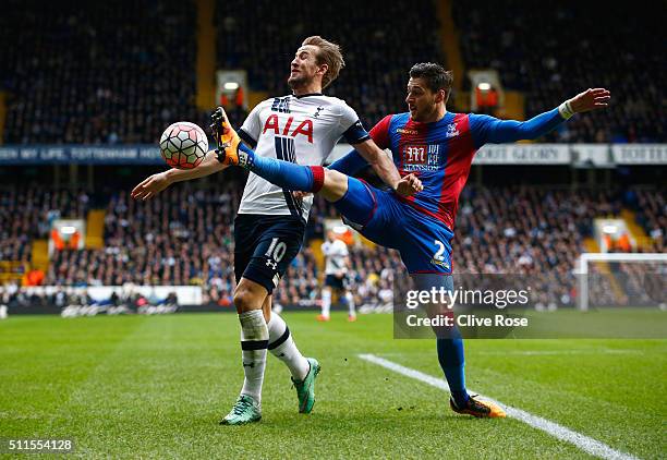 Harry Kane of Tottenham Hotspur is challenged by Joel Ward of Crystal Palace during the Emirates FA Cup Fifth Round match between Tottenham Hotspur...