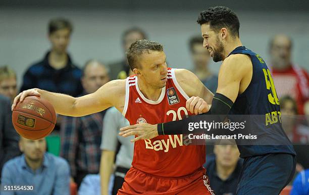 Dusko Savanovic of FC Bayern Muenchen challenges Mitchell Watt of ALBA Berlin during the Beko BBL TOP FOUR Final match between FC Bayern Muenchen and...