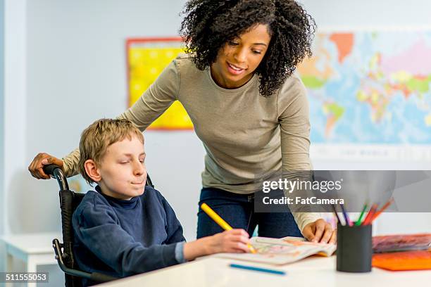 boy with developmental disability - teenager cerebral palsy stock pictures, royalty-free photos & images