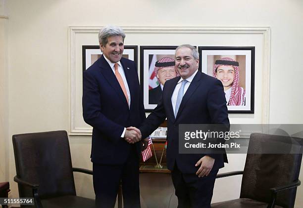 Secretary of Sate John Kerry shakes hands with Jordanian Foreign Minister Nasser Judeh on February 21, 2016 in Amman, Jordan. While in Ammnan. Kerry...