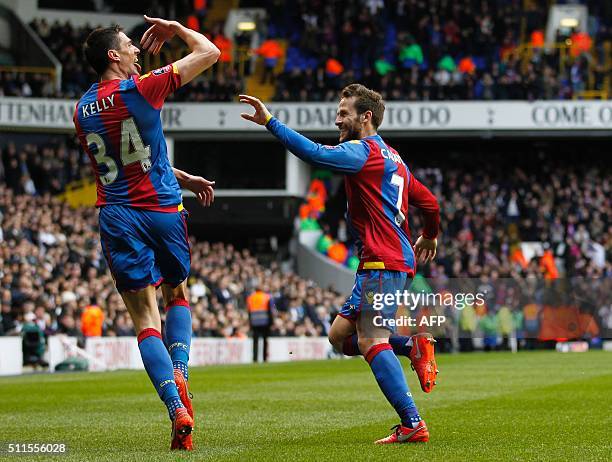 Crystal Palace's English defender Martin Kelly celebrates with Crystal Palace's French midfielder Yohan Cabaye after scoring the opening goal of the...