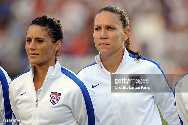 Ali Krieger and Lauren Holiday of the U.S. Women's national team look on prior to their match against the Swiss women's national team at WakeMed...
