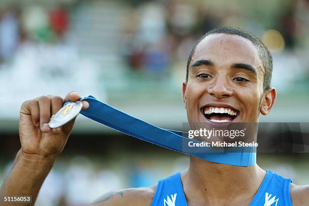 Andrew Howe of Italy celebrates with the Gold Medal he received for winning the Men's Triple Jump competition at the IAAF World Junior Championships...