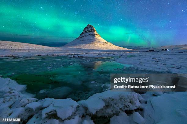 aurora over kirkjufell mountain iceland - majestic hotel stock pictures, royalty-free photos & images