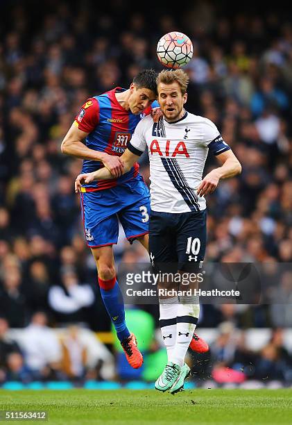 Martin Kelly of Crystal Palace jumps for a header with Harry Kane of Tottenham Hotspur during the Emirates FA Cup Fifth Round match between Tottenham...