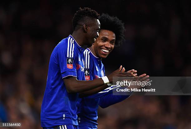 Bertrand Traore of Chelsea celebrates with teammate Willian after scoring his team's fifth goal during The Emirates FA Cup fifth round match between...