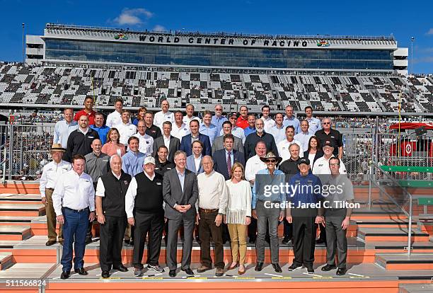 Executives and board members join the NASCAR Sprint Cup Series charter owners for a historic portrait in Victory Lane in advance of the 58th annual...