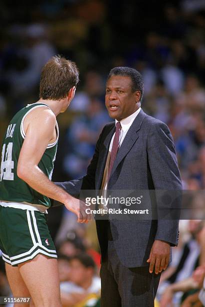 Danny Ainge of the Boston Celtics listens to head coach K.C. Jones during a NBA season game. K.C. Jones was the head coach of the Boston Celtics from...