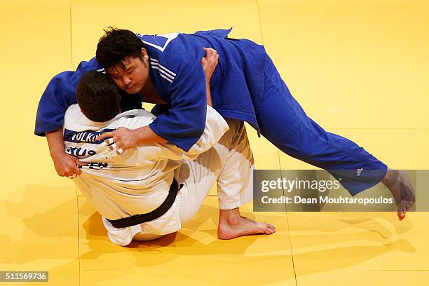 Sung-Min Kim of South Korea and Andrey Volkov of Russia compete during the Dusseldorf Judo Grand Prix in their Mens +100kg Bronze Medal match held at...