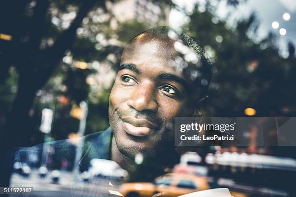 portrait of a man on the window of a cafe - winter car window stock pictures, royalty-free photos & images