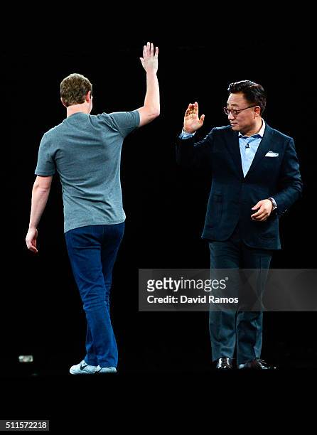 Founder and CEO of Facebook Mark Zuckerber and President of Mobile Communications Business of Samsung DJ Koh say goodbye during the presentation of...