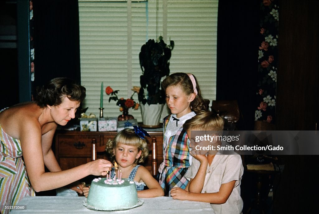 Mother And Children At Birthday