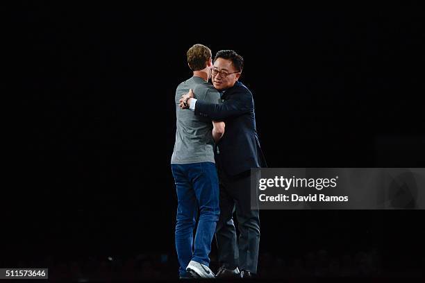 Founder and CEO of Facebook Mark Zuckerber and President of Mobile Communications Business of Samsung DJ Koh hug during the presentation of the new...