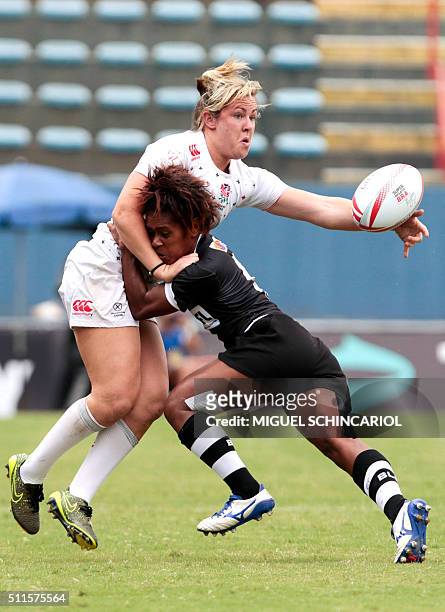 Marlie Packer of England vies for the ball with Ana Maria Roqica of Fiji during their World Rugby Women's Sevens Series match in Barueri, some 30 km...