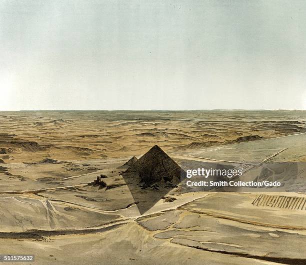 Color lithograph depicting a panorama of the second pyramid of Giza, lit from behind, long shadow in the foreground, titled Giseh [Jîzah]: Panorama...