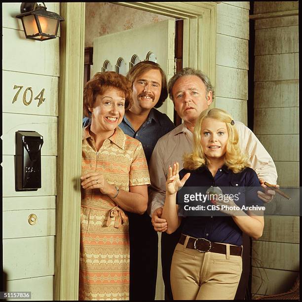Promotional still shows the cast from the American television show 'All in the Family,' Los Angeles, California, early 1970s. They stand in the...