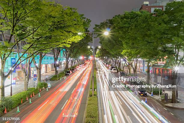 tokyo cityscape with traffic light trails - omotesando stock pictures, royalty-free photos & images