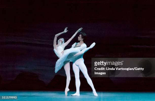 Russian dancers Anna Nikulina and Artem Ovcharenko perform during Act I in the Bolshoi Ballet production of 'Swan Lake' during the Lincoln Center...