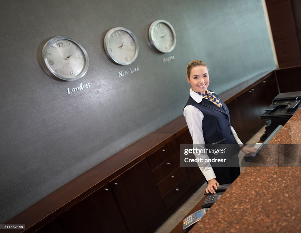 Woman running the front desk at a hotel