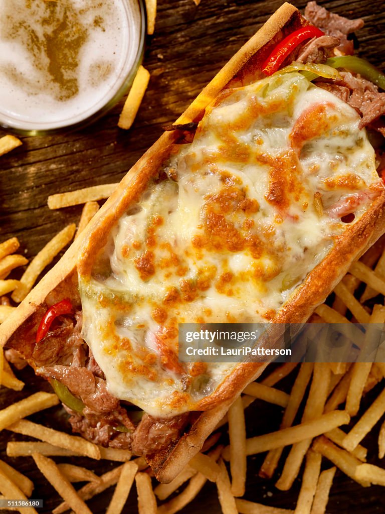 Philly Provolone, Cheese Steak Sandwich with Fries and a Beer