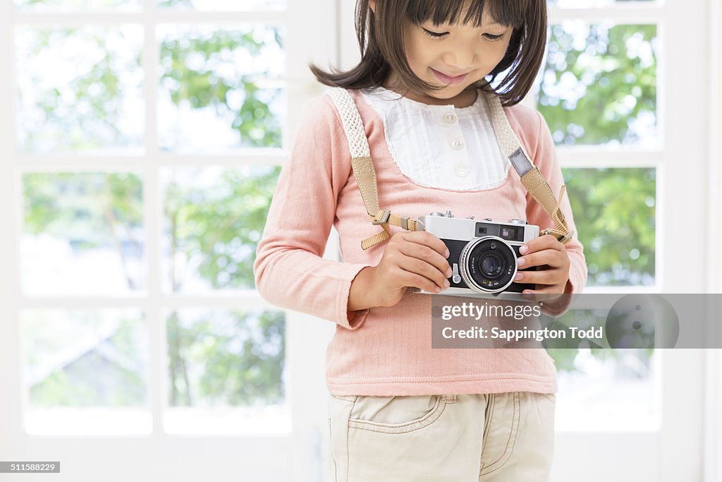 Girl Holding Camera