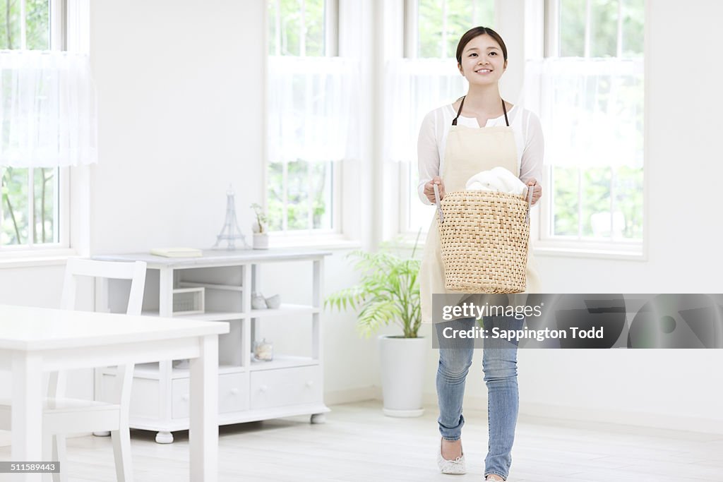 Woman Carrying Laundry Basket