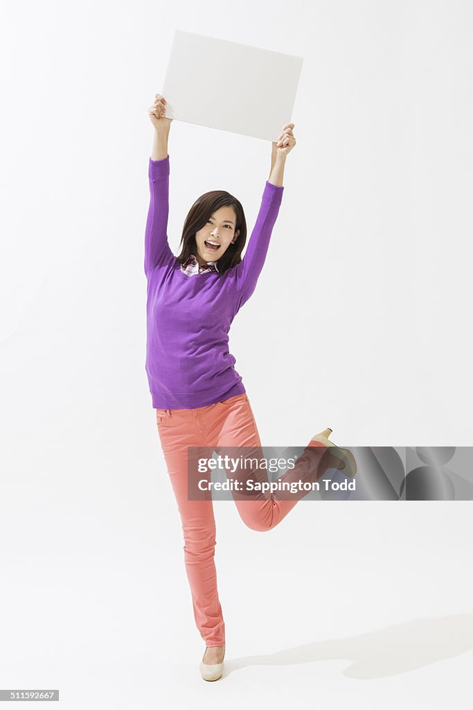 Young Woman Holding Placard