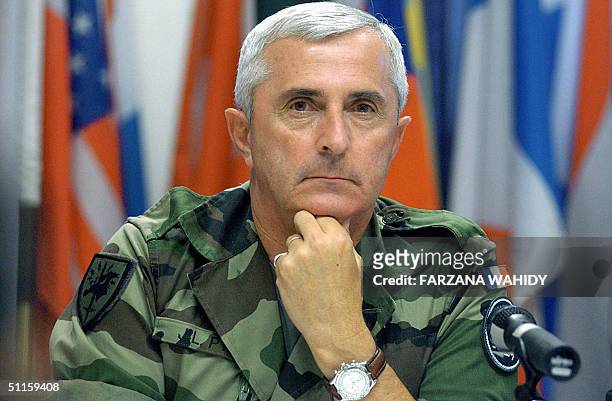 Commander of the Eurocorps General Jean-Louis Py gestures during a press breifing in Kabul, 11 August 2004. General Jean-Louis PY, commander of the...