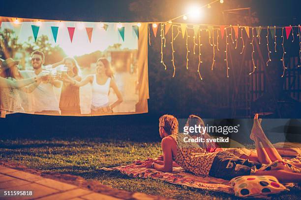 romantic movie night - loving 2016 film stock pictures, royalty-free photos & images