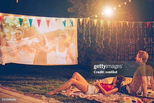 romantic movie night - loving 2016 film stock pictures, royalty-free photos & images