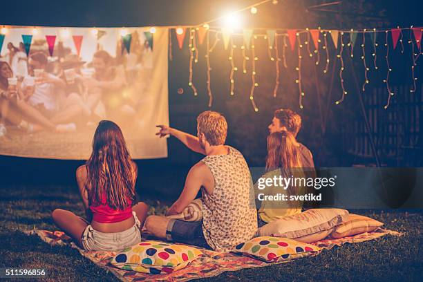 movie night with friends - loving 2016 film stock pictures, royalty-free photos & images