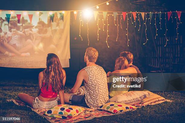 movie night with friends - loving 2016 film stock pictures, royalty-free photos & images