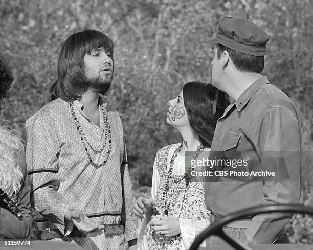 American actor Rob Reiner gestures as he speaks with Leigh French and Jim Nabors in an episode of 'Gomer Pyle, U.S.M.C.' called 'Flower Power,'...