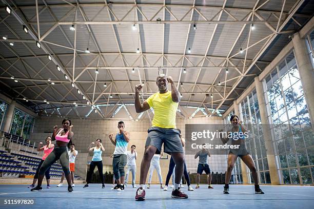 people exercising at the gym - zumba stock pictures, royalty-free photos & images