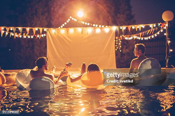 pool-party - lichterkette sommer stock-fotos und bilder