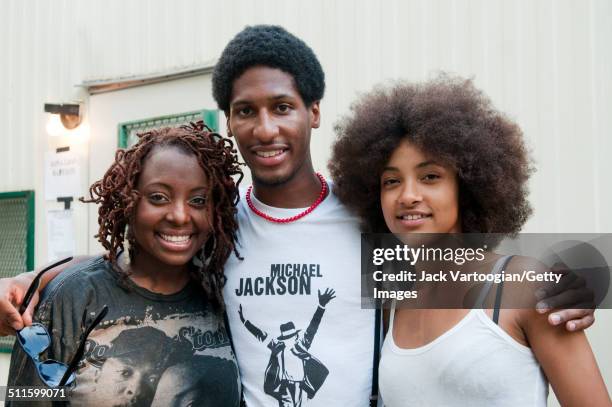 Portrait of, from left, American musicians Ledisi , Jonathan Batiste, and Esperanza Spalding as they pose backstage at Central Park SummerStage, New...