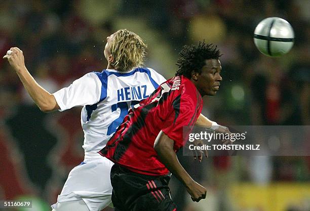 Bayer Leverkusen's Jose Roque Junior vies for the ball against Banik Ostrava's Marek Heinz during their 1st leg match of the qualification round of...