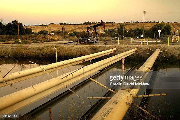 Canal leading from the Kern River is one of many that have been altered by the presence of thousands of wells pumping the oil fields of California's...