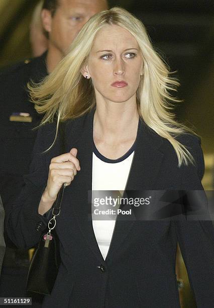 Amber Frey leaves the San Mateo County Courthouse after her second day of testimony in the Scott Peterson double murder trial on August 11, 2004 in...