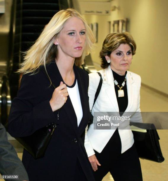 Amber Frey leaves the San Mateo County Courthouse flanked by her lawyer Gloria Allred after Frey's second day of testimony in the Scott Peterson...