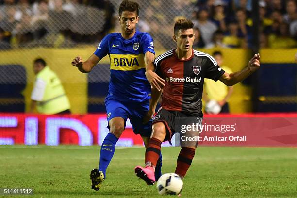 Lucas Boye of Newell's fights for the ball with Rodrigo Bentancur of Boca Juniors during the 4th round match between Boca Juniors and Newell's Old...