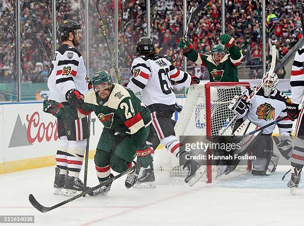 Matt Dumba of the Minnesota Wild celebrates his goal along with Ryan Carter at 3:25 of the first period against Corey Crawford of the Chicago at the...